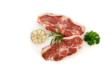 Lamb meat on stone tray on white concrete background