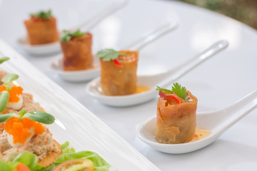 Spring rolls in white spoon