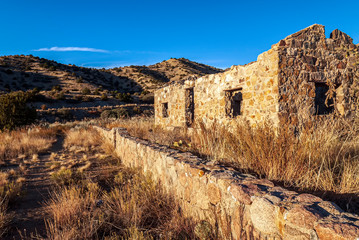 Old Abandoned Stone House and Wall Late Afternoon