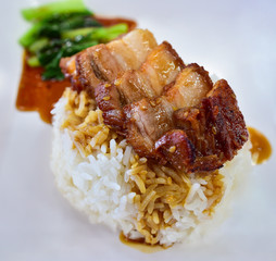 Crispy pork in juicy sauce with rice (Thai food)