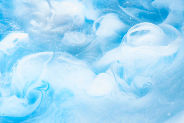 Abstract blue clear sky background with white soft clouds of smoke, lightness and weightlessness,...