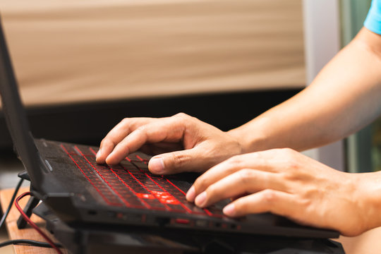 Close Up Man Hands Using Lap Top Computer.