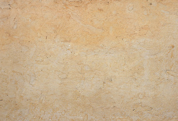 Yellow stone wall background