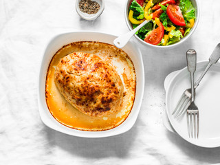Chicken roasted meatloaf and fresh vegetable salad on a light background, top view. Healthy balanced diet food