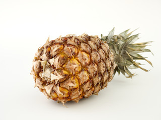 Delicious ripe Pineapple and its slices on a white background.Isolate