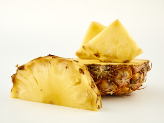 Delicious ripe Pineapple and its slices on a white background.Isolate