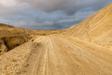 road to mud volcanoes of Gobustan near Baku, Azerbaijan. road and stormy sky