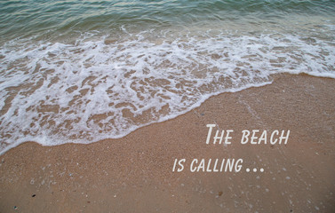 The beach is calling word design on sand beach photo