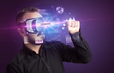 Fototapeta na wymiar Businessman looking through Virtual Reality glasses with DEMAND inscription, new business concept