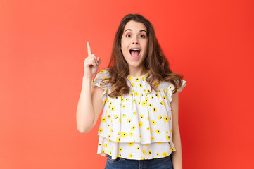 young pretty woman feeling like a happy and excited genius after realizing an idea, cheerfully...