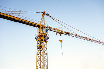 yellow crane with blue sky as background