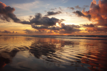 Fototapeta na wymiar colorful sunrise, reflections, beach somewhere in Brazil