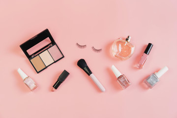 Obraz premium Woman cosmetics and make up on pink background, Top view