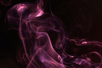 Smoke flashed with colorful foils and photographed in the studio