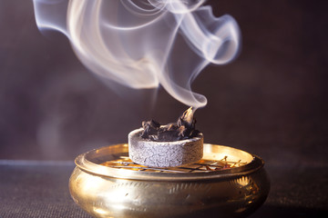 Smoke flashed with colorful foils and photographed in the studio
