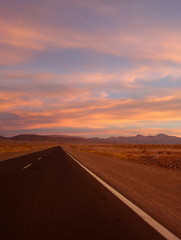 Fototapeta na wymiar Magical sunset on the roadway to Salinas grandes (large salines) on the north of argentina