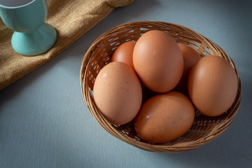 All your eggs in one basket. concept , eggs in basket on table.