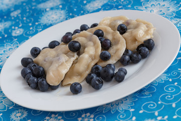 Russian dumplings vareniki filled with fresh blueberries