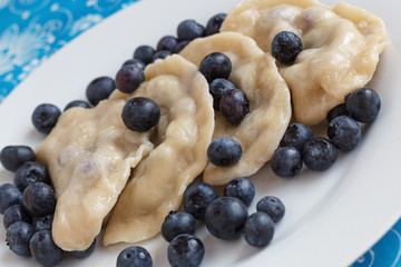 Russian dumplings vareniki filled with fresh blueberries