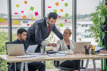 Group of employees and management team work together to brainstorm, solve problems and formulate strategies for working in working space at office.Teamwork concept