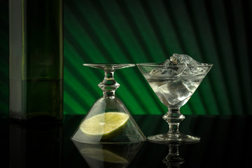 Two martini glass with lime and ice