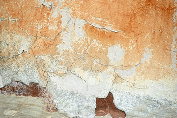 The structure of an old painted concrete wall.