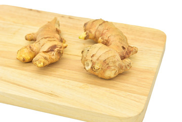 Fresh Gingers on Wooden Board