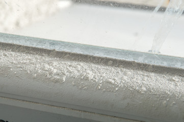 Close-up of a dusty window frame.