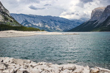Lake Minnewanka with the Canadian Rockies in the background on a stormy day, Banff National Park, Canada