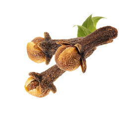 dry spicy cloves with green leaves isolated on white background