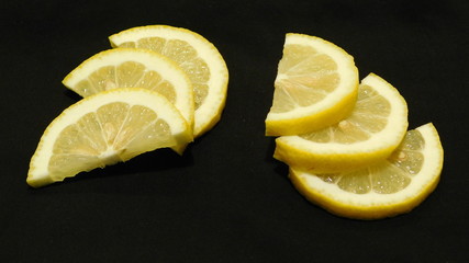 lemon slices on a black background close-up  