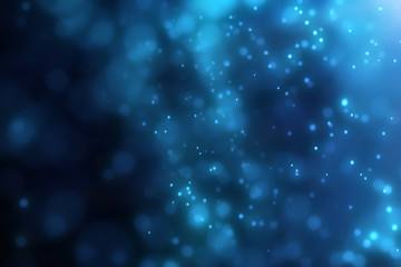 Obraz premium Jasny niebieski bokeh światła abstrakcyjne tło. Latające cząsteczki lub kurz. Żywa błyskawica. Wesołych Świąt Bożego Narodzenia projekt. Niewyraźne jasne kropki. Może służyć jako okładka, baner, pocztówka, ulotka.