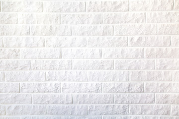 Background of a white decorative brick wall with a seam. Interior, backgrounds, structure.
