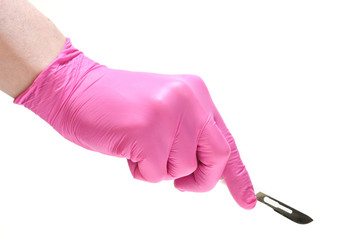hand in red glove with scalpel isolated on white
