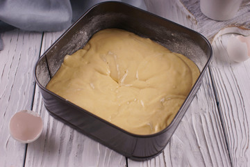 Baking dish with biscuit dough inside
