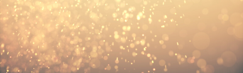 Bright golden bokeh lights abstract background. Flying gold particles or dust. Vivid lightning. Merry christmas design. Blurred light dots. Can use as cover, banner, postcard, flyer.