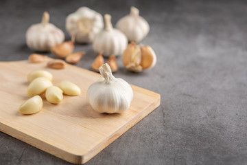 Garlic on the black cement floor. High angle view.