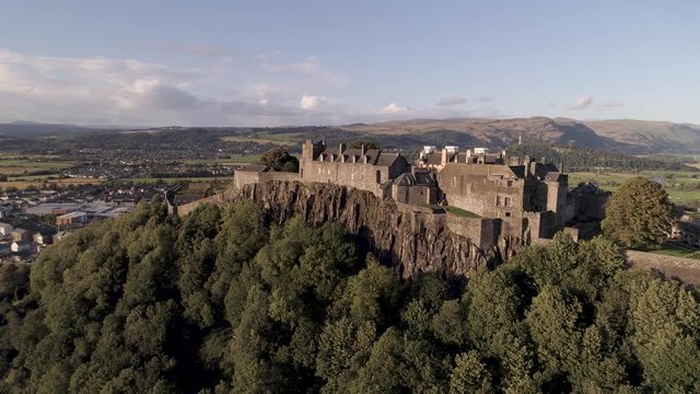 Stirling castle aerial pan and orbital shot from east to west, looking north on a bright and sunny day