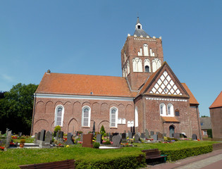 Fototapeta premium Beautiful old church with cemetery