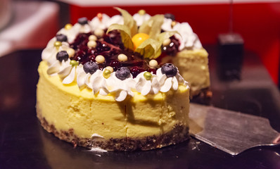 Selective Focused Freshly Baked Homemade Delicious Chocolate Brownie Cake decorated with fresh cape gooseberry and berry fruit. Food Catering, Healthy Dessert, Sweet, Treat, Cooking and Hobby concept