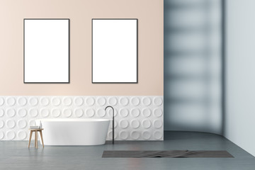 Beige and gray bathroom with tub and posters