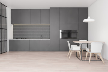 Kitchen interior with gray countertops and table