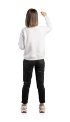 Casual woman writing on wall, isolated