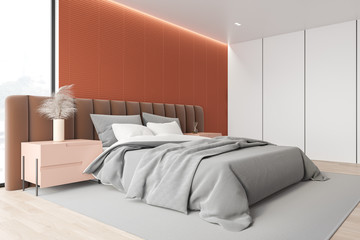 Orange and white master bedroom corner