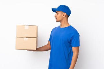 Delivery man over isolated white background with happy expression