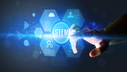 Hand touching STEM inscription, new technology concept
