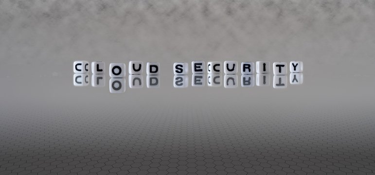 Cloud Security Concept Represented By Black And White Letter Cubes On A Grey Digital Background