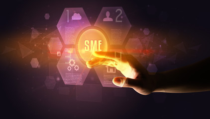 Hand touching SME inscription, new technology concept