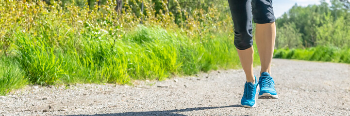 Fitness woman running at forest trail Woman fitness legs. Jogging workout wellness concept. Close up of woman athlete legs in park on sunny day. Workout. Sport Girl running in a forest outfit.  Header