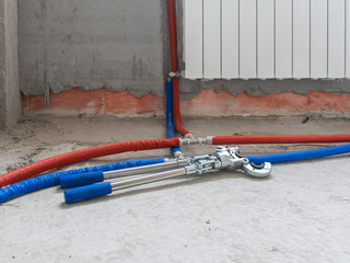 Plumbing copper pipe crimper press tube tool. Heating pipes connected by press fittings. Hydraulic, tools for plumber.